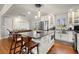 Modern kitchen with white cabinets, stainless steel appliances, and a large island at 3384 Campbell Se Rd, Smyrna, GA 30080