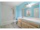 Bathroom with shower/tub combo and light wood vanity at 4745 Elam Forest Dr, Stone Mountain, GA 30083