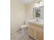 Simple bathroom with light wood vanity and tiled floor at 4745 Elam Forest Dr, Stone Mountain, GA 30083