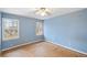 Blue bedroom with two windows and new flooring at 4745 Elam Forest Dr, Stone Mountain, GA 30083