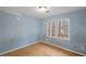 Bedroom with window and new flooring at 4745 Elam Forest Dr, Stone Mountain, GA 30083