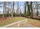 View from deck showcasing spacious backyard and trees at 4745 Elam Forest Dr, Stone Mountain, GA 30083