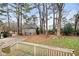 Backyard view from deck with trees and partial house view at 4745 Elam Forest Dr, Stone Mountain, GA 30083