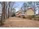 Two-story house with mature trees and landscaping at 4745 Elam Forest Dr, Stone Mountain, GA 30083