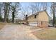 Ranch house with attached garage and driveway at 4745 Elam Forest Dr, Stone Mountain, GA 30083