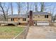 Rear view of house, showing deck and garage at 4745 Elam Forest Dr, Stone Mountain, GA 30083