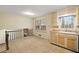 Kitchen features light wood cabinets and a window overlooking backyard at 4745 Elam Forest Dr, Stone Mountain, GA 30083