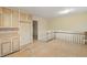 Kitchen with light wood cabinets and vinyl flooring at 4745 Elam Forest Dr, Stone Mountain, GA 30083