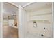 Unfinished laundry area with built-in shelving at 4745 Elam Forest Dr, Stone Mountain, GA 30083