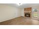 Living room with brick fireplace and hardwood floors at 4745 Elam Forest Dr, Stone Mountain, GA 30083