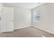 Bright bedroom featuring carpet and a window with blinds at 6897 Estepona St, Atlanta, GA 30349