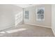 Bright bedroom with neutral walls and carpet at 6897 Estepona St, Atlanta, GA 30349