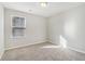 Simple bedroom with neutral walls and carpet at 6897 Estepona St, Atlanta, GA 30349