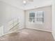 Bright bedroom with neutral walls and carpet at 6897 Estepona St, Atlanta, GA 30349