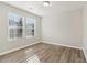 Spacious bedroom with neutral walls and wood-look floors at 6897 Estepona St, Atlanta, GA 30349