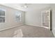 Spacious bedroom with neutral walls, carpet, and ceiling fan at 6897 Estepona St, Atlanta, GA 30349