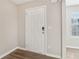 Interior entry door with neutral-colored walls and wood-look floors at 6897 Estepona St, Atlanta, GA 30349