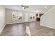 Living room with ceiling fan and wood-look floors at 6897 Estepona St, Atlanta, GA 30349