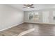 Living room with ceiling fan and sliding glass door at 6897 Estepona St, Atlanta, GA 30349