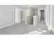 Upstairs hallway with neutral walls and carpet at 6897 Estepona St, Atlanta, GA 30349