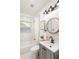 Clean bathroom with white subway tile, gray vanity, and black fixtures at 994 Byron Sw Dr, Atlanta, GA 30310