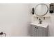 Modern bathroom with vanity, mirror, and wall sconces at 994 Byron Sw Dr, Atlanta, GA 30310