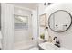 Updated bathroom featuring white subway tile and gray vanity at 994 Byron Sw Dr, Atlanta, GA 30310