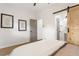 Bedroom with a queen bed and en-suite bathroom with barn door at 994 Byron Sw Dr, Atlanta, GA 30310