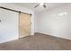 Bright bedroom with light brown carpet and a barn door at 994 Byron Sw Dr, Atlanta, GA 30310