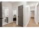 Bright hallway with gray doors, light walls, and wood-look flooring at 994 Byron Sw Dr, Atlanta, GA 30310