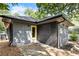 Gray and black exterior with a yellow door and a patio at 994 Byron Sw Dr, Atlanta, GA 30310