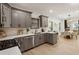 Modern kitchen featuring gray cabinets, quartz countertops, and stainless steel appliances at 994 Byron Sw Dr, Atlanta, GA 30310