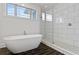 Spa-like bathroom with freestanding tub and walk-in shower at 1433 Sugarmill Oaks Ave, Atlanta, GA 30316