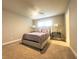 Comfortable bedroom with carpeted floors and window at 184 Camdale Ct, Mcdonough, GA 30252