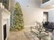 Spacious living room with a large Christmas tree and fireplace at 184 Camdale Ct, Mcdonough, GA 30252