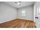 Spacious bedroom with wood-look floors and a large window at 452 Lindsay Nw St, Atlanta, GA 30314
