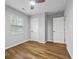 Simple bedroom with wood-look floors and window at 452 Lindsay Nw St, Atlanta, GA 30314