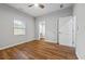 Bedroom featuring wood-look floors, private bath access, and a ceiling fan at 452 Lindsay Nw St, Atlanta, GA 30314