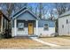 Charming craftsman style home with a yellow front door at 452 Lindsay Nw St, Atlanta, GA 30314