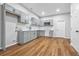 Modern kitchen with gray cabinets, quartz counters, and stainless steel appliances at 452 Lindsay Nw St, Atlanta, GA 30314