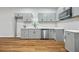Modern kitchen featuring gray cabinets and stainless steel appliances at 452 Lindsay Nw St, Atlanta, GA 30314