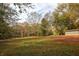 Large backyard with shed and wooded backdrop at 105 Tranquillity Dr, Villa Rica, GA 30180