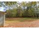 Backyard view with shed and wooded area at 105 Tranquillity Dr, Villa Rica, GA 30180