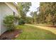 Well-maintained backyard showcasing a brick-edged garden and lush green space at 105 Tranquillity Dr, Villa Rica, GA 30180