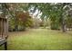 Spacious backyard with trees and a pond at 105 Tranquillity Dr, Villa Rica, GA 30180