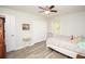 Cozy bedroom with ceiling fan and hardwood floors at 105 Tranquillity Dr, Villa Rica, GA 30180