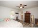 Bedroom featuring new flooring, ceiling fan and a large dresser at 105 Tranquillity Dr, Villa Rica, GA 30180