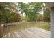 Wooden deck with view of large backyard and trees at 105 Tranquillity Dr, Villa Rica, GA 30180