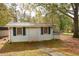 Exterior home structure with a sidewalk and small front windows at 105 Tranquillity Dr, Villa Rica, GA 30180