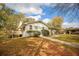 Exterior of the house with a private deck, manicured bushes, and a convenient covered parking area at 105 Tranquillity Dr, Villa Rica, GA 30180